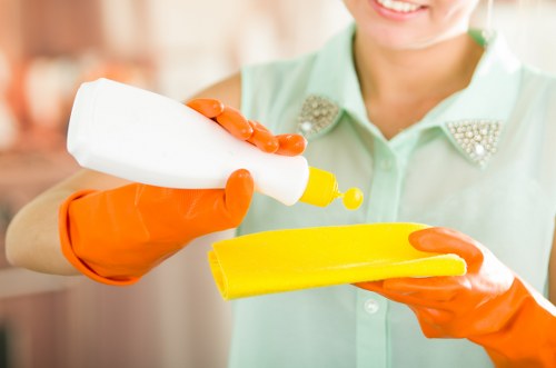 Professional post-construction cleaning tools in a vacant room